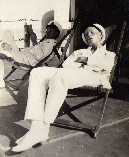Chief and Sub Lt Colin G.W. Donald in deck chairs on HMS VEnomous