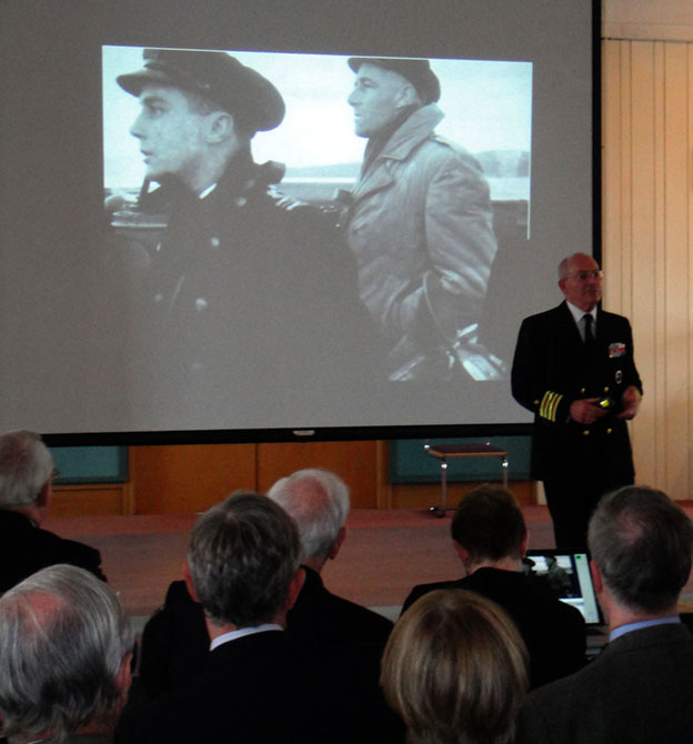 Captain John Rodgaard USN speaking at the book launch of "A Hard Fought Ship"