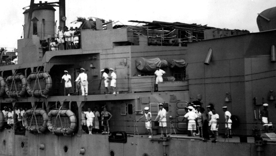 Officers and men lining the deck of HMS Hecla